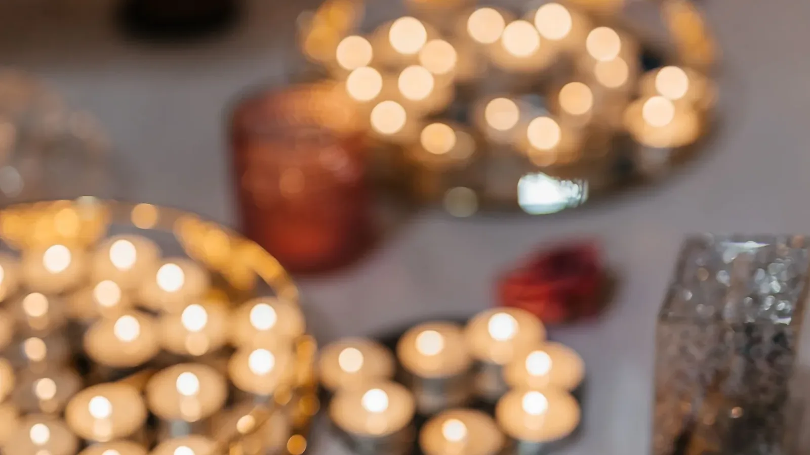 Lit Shabbat candles on a table during a Jewish group event in Poland